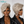 Two views of a woman with styled hair wearing earrings on a plain background, featuring the BeQueen brand.